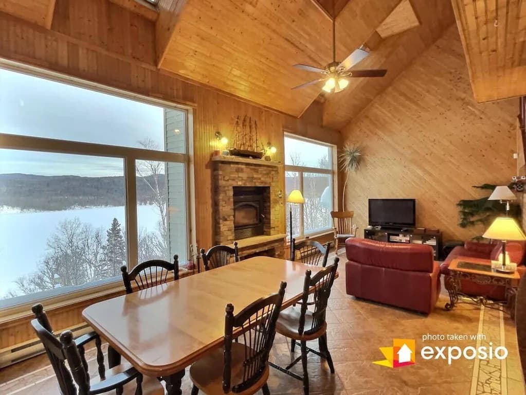 Dining table, fireplace and the lake